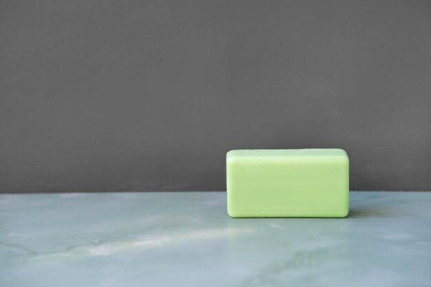 Photo green bath soap body bar on gray background