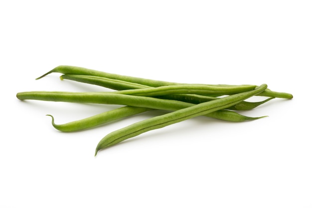 Green beans isolated on a white surface.