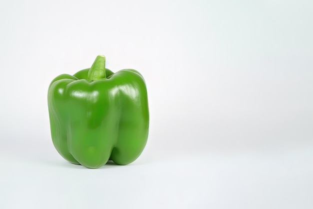 green bell pepper isolated on white background with copy space