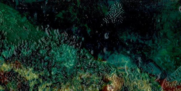 Photo a green and blue ocean with a green coral in it