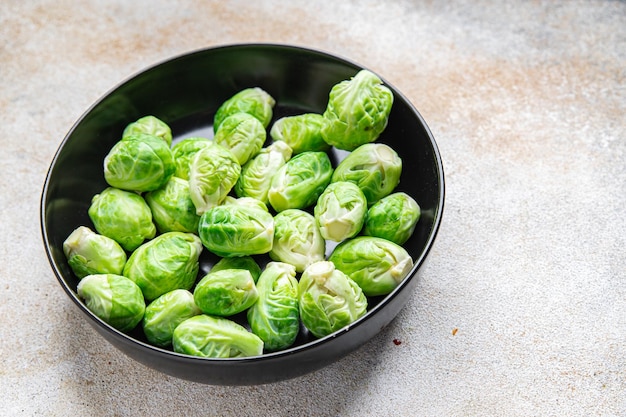 green Brussel sprouts raw vegetable food snack on the table copy space food background top