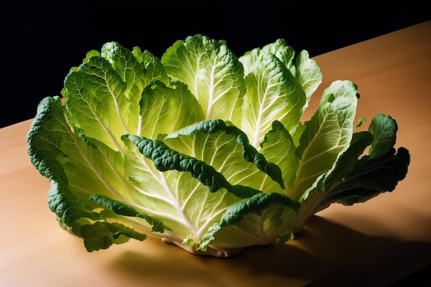 A green cabbage sits on a table.