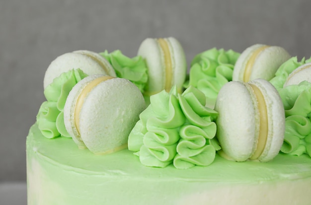 Green cake macaroons and cream macro decor