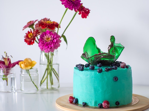 Green cake with blueberry on white background