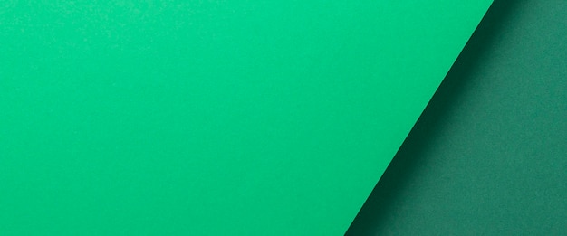 Photo green cardboard background design folded geometrically. top view, flat lay. banner.