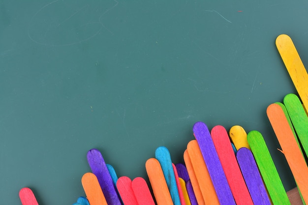 Green chalkboard with colorful ice cream sticks