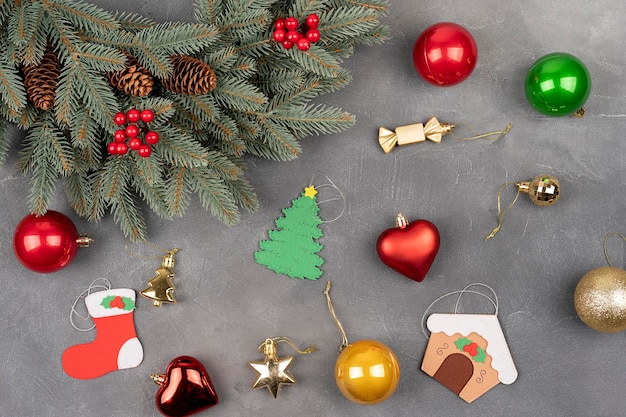 Green Christmas wreath with decorations and balls on gray concrete background Christmas celebrate