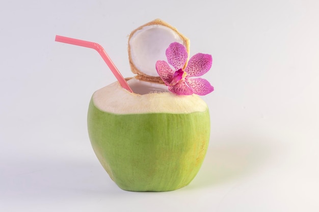 Green coconuts with drinking straw isolated