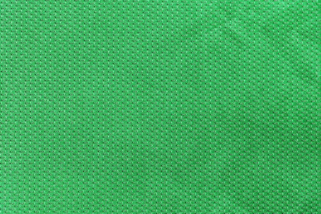 Green color sports clothing fabric football shirt jersey texture and textile background.