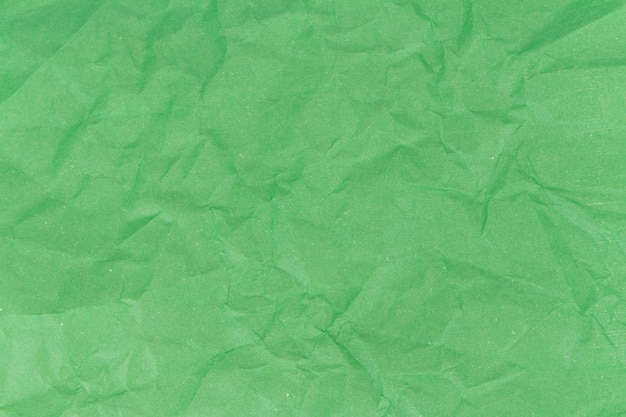 Green crumpled paper texture background