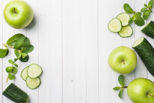 Green cucumber mint Apple on the table. 