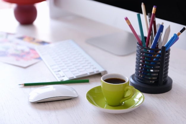 Green cup of coffee on modern table