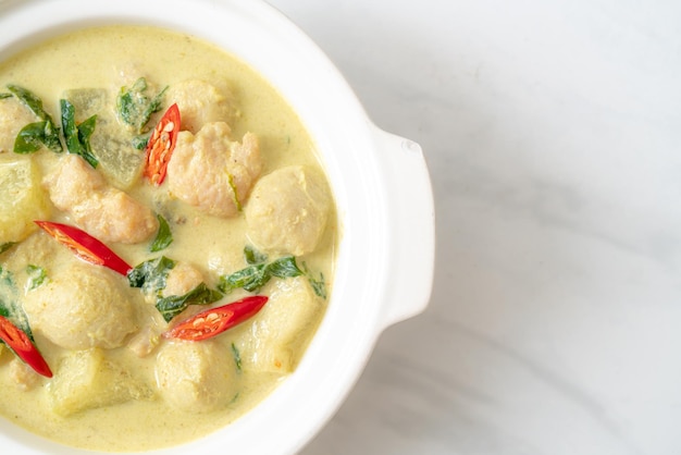 green curry soup with minced pork and meat ball in bowl - Asian food style