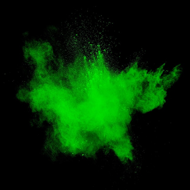 Green dust explosion on black background Colored powder splatter on background