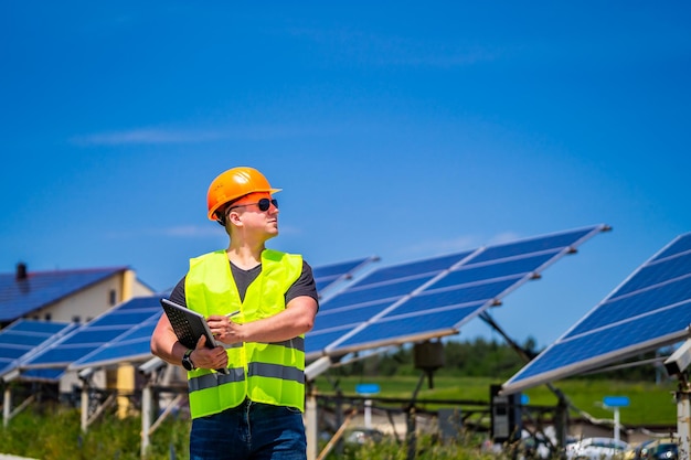 Green energy worker is conducting onsite inspection visit at the new energy base