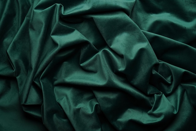 Green fabric background view from above