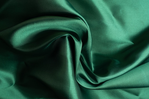 Green fabric texture background, abstract, closeup texture of cloth