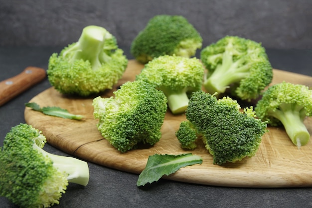 Green fresh broccoli on a wooden cutting board