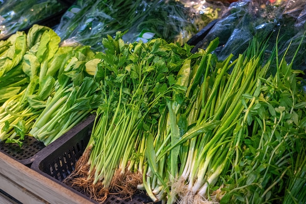 Green fresh herbs on grocery shelf