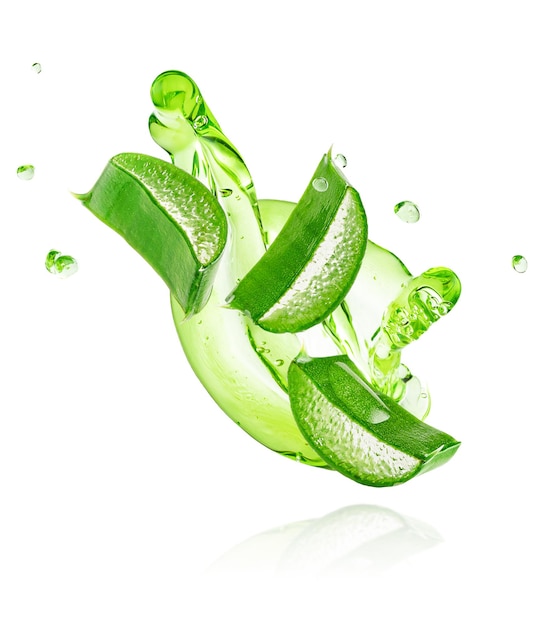 Green gel flowing with aloe vera slices isolated on white background with clipping path. High quality photo