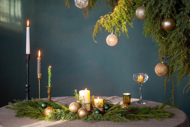 green and golden christmas decor on table on dark background