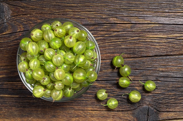 Green gooseberries in a glass bowl