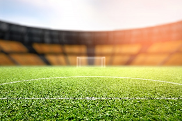 Green grass and soccer goalpost with tribune