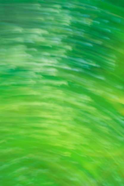 Green grass sparkling motion abstract swirl Abstract green shiny swirl wave out of focus background