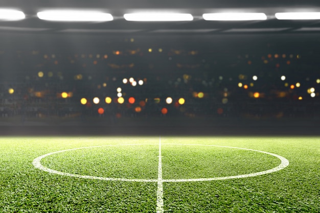 Green grass and tribune with blurred lights