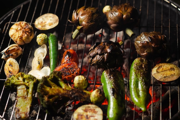 Green grilling Various vegetables artichokes peppers eggplants are grilled Closeup Healthy food concept Vegetarianism