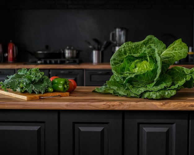 Green ingredients like cabbage, pepper for cooking vegetable meal on the table