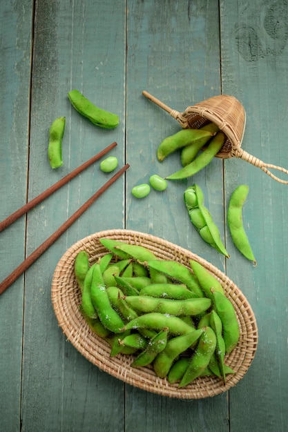 Green Japanese Soybean in wooden bowl on table wood