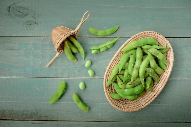 Green Japanese Soybean in wooden bowl on table wood