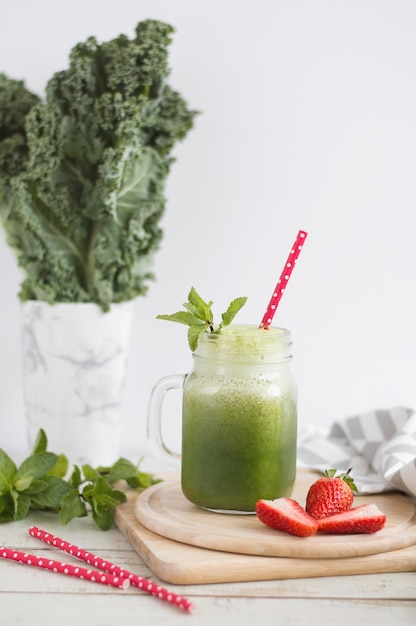 Green kale smoothie with mint and strawberry