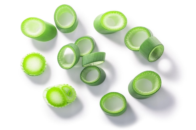 Photo green leek cut into rings isolated w clipping paths top view