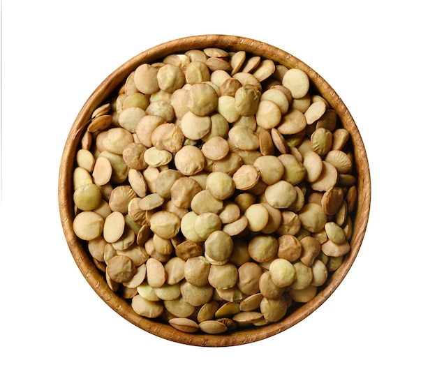 Green lentil in wooden bowl isolated on white background, top view