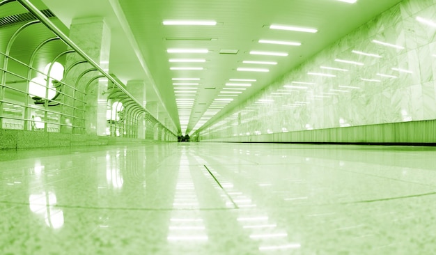 A green light is on the floor of a building