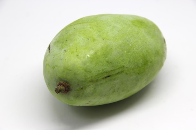 a green mango is shown on a white background