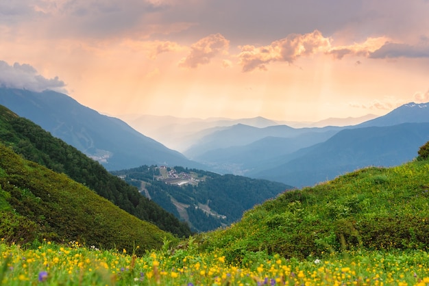 Green mountain peaks. Layers of mountains in the haze during sunset. Multilayered misty nountains