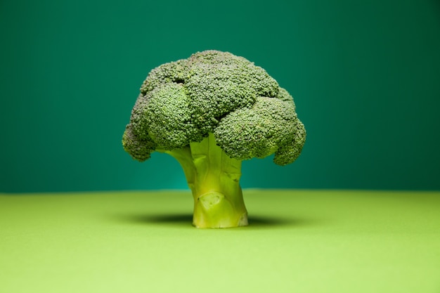 Green nutrient broccoli against two color background