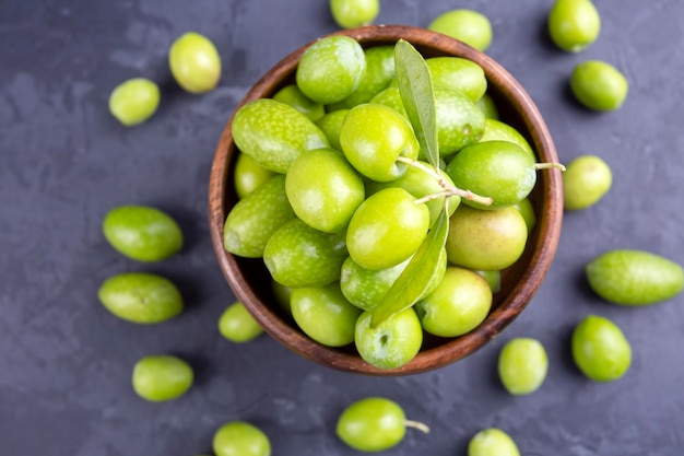 Green olive on the black background