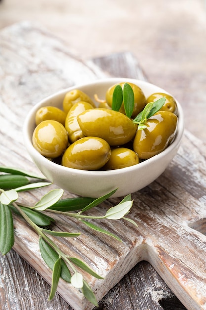 Green olives on gray background