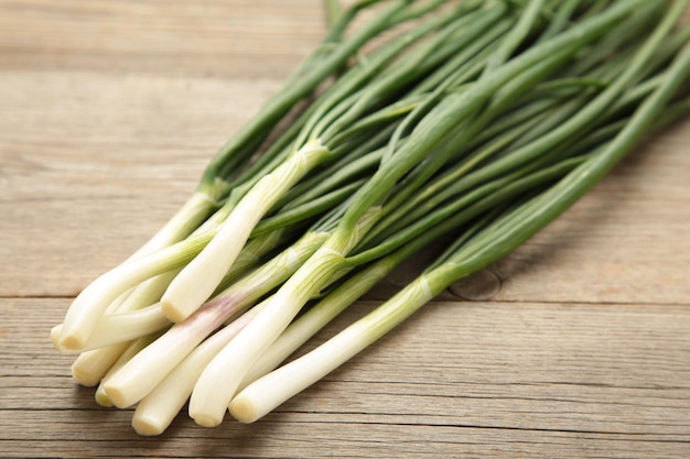 Green onion on a grey wooden background