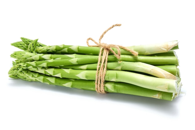 Green organic natural asparagus isolated on white background