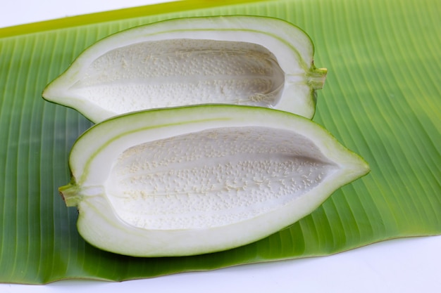 Green papaya on banana leaf