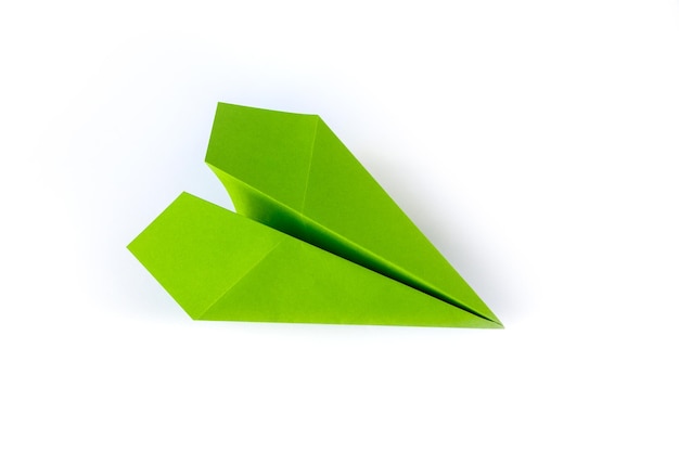 Green paper plane origami isolated on a white background