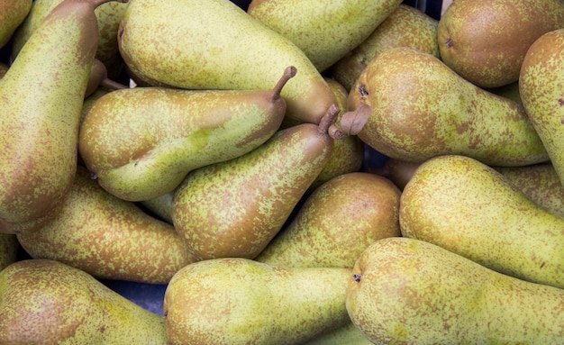 Green pears at a market close up