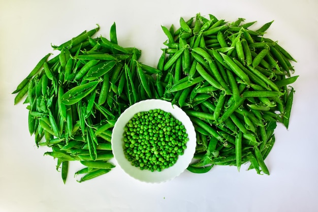 Green peas in a white bowl peeled and in tarts The concept of proper nutrition