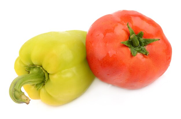 Green pepper and tomato on white