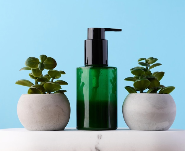 Green plastic bottle with dispenser Container for cosmetics